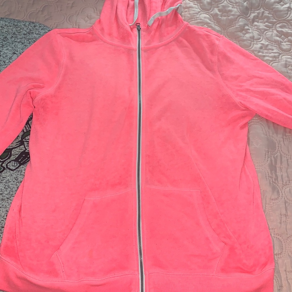 Light pink zip up sweatshirt.